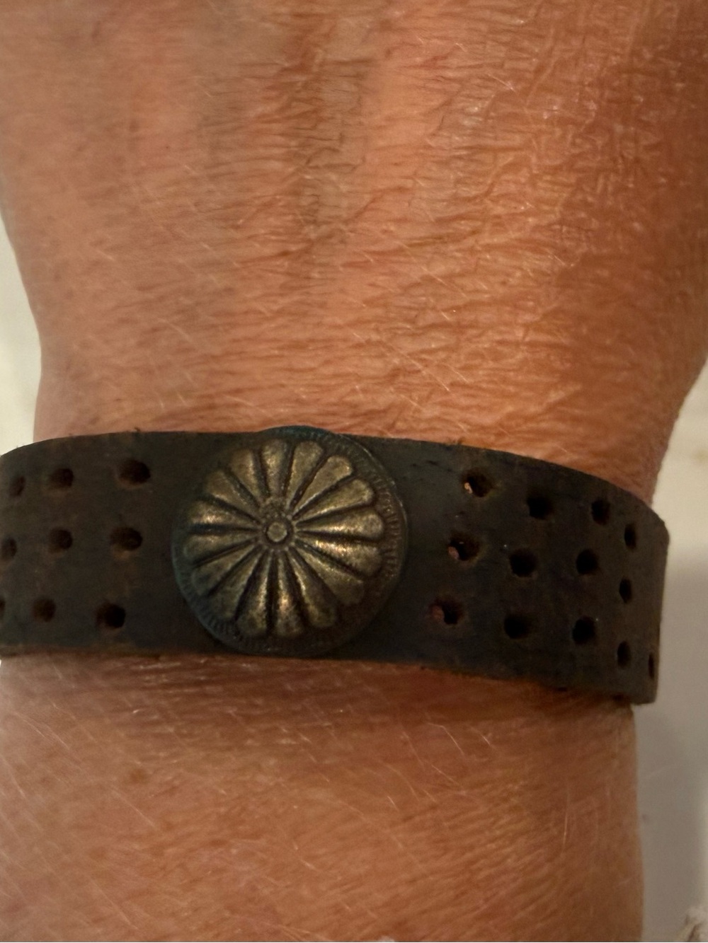 Brown Leather Perforated Bracelet with Decorative Metal Accent